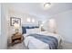 Inviting bedroom with plush carpet, large bed, and modern decor at 46559 Avery Ln, Bennett, CO 80102