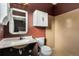 Small bathroom with a sink and toilet at 14442 E 102Nd Pl, Commerce City, CO 80022