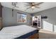 Primary bedroom with ensuite bathroom and ceiling fan at 14442 E 102Nd Pl, Commerce City, CO 80022