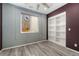 Bedroom with built-in shelving and window at 14442 E 102Nd Pl, Commerce City, CO 80022