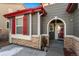 Front entrance with red door and stone accents at 14442 E 102Nd Pl, Commerce City, CO 80022