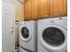 Spacious laundry room with side-by-side washer and dryer at 14442 E 102Nd Pl, Commerce City, CO 80022