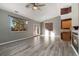Spacious living room with fireplace and hardwood floors at 14442 E 102Nd Pl, Commerce City, CO 80022