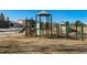 Community playground with playset and slide at 14442 E 102Nd Pl, Commerce City, CO 80022
