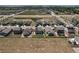 Neighborhood aerial view showing fenced yards, modern home designs, and community layout at 7414 Blue River Ave, Frederick, CO 80530