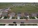 A full aerial view of the neighborhood, showcasing green spaces and community layout at 7414 Blue River Ave, Frederick, CO 80530