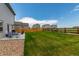 Lush, green backyard with a patio area ideal for relaxation and enjoying the outdoors at 7414 Blue River Ave, Frederick, CO 80530