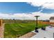 Inviting backyard features a large lawn and patio perfect for entertaining at 7414 Blue River Ave, Frederick, CO 80530