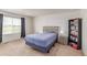 Bright bedroom features a plush carpet, large windows, and ample natural light at 7414 Blue River Ave, Frederick, CO 80530