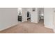 Bedroom leads to bathroom and bedroom with neutral paint at 7414 Blue River Ave, Frederick, CO 80530