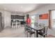 Eat-in kitchen area features sleek countertops, stainless steel appliances, and natural light at 7414 Blue River Ave, Frederick, CO 80530