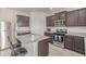 Kitchen featuring stainless steel appliances, countertops, a gas range, and a center island at 7414 Blue River Ave, Frederick, CO 80530