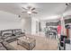 Spacious living room featuring a ceiling fan, and an adjacent eat-in kitchen at 7414 Blue River Ave, Frederick, CO 80530