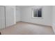 Unfinished basement with tile floors, egress window and closet at 3619 N York St, Denver, CO 80205