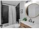 Stylish bathroom features modern fixtures, sleek black tiling, and a contemporary design at 3619 N York St, Denver, CO 80205