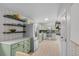 Well-lit kitchen featuring modern appliances, stylish countertops, and unique wallpaper at 3619 N York St, Denver, CO 80205