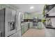 Updated kitchen with stainless steel appliances, shaker cabinets, and lots of natural light at 3619 N York St, Denver, CO 80205