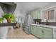 Bright kitchen featuring stainless steel appliances, light countertops, and a modern design at 3619 N York St, Denver, CO 80205