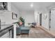 Cozy living room featuring modern decor, a comfortable couch, and an inviting area rug on tile flooring at 3619 N York St, Denver, CO 80205