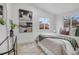 Bright main bedroom features modern decor, natural light and light colored hardwood floors at 3619 N York St, Denver, CO 80205
