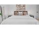 Inviting main bedroom with king size bed, accent lighting, and neutral color scheme at 3619 N York St, Denver, CO 80205