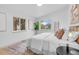 Serene main bedroom with large windows, neutral decor, and comfortable layout at 3619 N York St, Denver, CO 80205