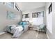 Bedroom with high ceilings, decorative art, and doorway to living area at 4713 Spine Rd # D, Boulder, CO 80301