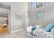 Bedroom with high ceilings, decorative art, and doorway to living area at 4713 Spine Rd # D, Boulder, CO 80301