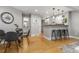 Open concept dining area featuring adjacent kitchen and hardwood floors throughout at 4713 Spine Rd # D, Boulder, CO 80301
