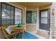 Charming front porch featuring a cozy seating area, blue accents, and a warm welcome at 4713 Spine Rd # D, Boulder, CO 80301