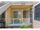 Inviting front porch with seating area and blue accent rug welcomes you home at 4713 Spine Rd # D, Boulder, CO 80301