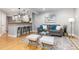 Open concept living room with hardwood floors, kitchen bar seating, and modern decor at 4713 Spine Rd # D, Boulder, CO 80301