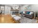 Open concept living room flows into the kitchen with seating at breakfast bar at 4713 Spine Rd # D, Boulder, CO 80301