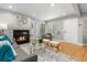 Inviting living room featuring a cozy fireplace, hardwood floors, and natural light at 4713 Spine Rd # D, Boulder, CO 80301