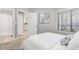 Bedroom with ensuite bath and view to kitchen at 4713 Spine Rd # D, Boulder, CO 80301