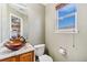 Stylish bathroom with a vessel sink and marble vanity at 9752 Dahlia Ln, Thornton, CO 80229