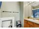 Clean bathroom with a shower/tub combo and wood vanity at 9752 Dahlia Ln, Thornton, CO 80229