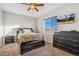 Spacious bedroom with a ceiling fan and large windows at 9752 Dahlia Ln, Thornton, CO 80229