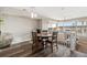 Open dining area features wood floors and staircase access at 9752 Dahlia Ln, Thornton, CO 80229