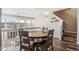 Spacious dining area featuring wood floors with open view of the living room at 9752 Dahlia Ln, Thornton, CO 80229
