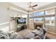 Comfortable living room with a cozy fireplace and large windows at 9752 Dahlia Ln, Thornton, CO 80229