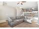 Comfortable living room with neutral tones, a staircase, and a view to the kitchen at 9752 Dahlia Ln, Thornton, CO 80229