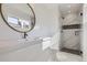 Modern bathroom with a glass-door shower, marble floors, and a contemporary vanity at 2582 S Birch St, Denver, CO 80222