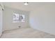 Bright bedroom with wood floors and a large window bringing in natural light at 2582 S Birch St, Denver, CO 80222