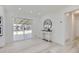 Bright dining room with modern furniture, light wood floors, and a sliding glass door to the backyard at 2582 S Birch St, Denver, CO 80222