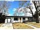 Charming single-story home featuring a well-maintained lawn, brick accents, and inviting curb appeal at 2582 S Birch St, Denver, CO 80222