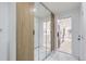 Bright hallway featuring marble floors, mirrored closet doors, and a glimpse into the kitchen at 2582 S Birch St, Denver, CO 80222