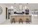 Stylish kitchen island with modern stools and stainless steel appliances at 2582 S Birch St, Denver, CO 80222