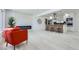 Bright living room featuring a modern fireplace, breakfast bar, and an open floor plan at 2582 S Birch St, Denver, CO 80222