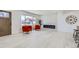 Bright living room with modern fireplace, light wood floors, and natural light at 2582 S Birch St, Denver, CO 80222